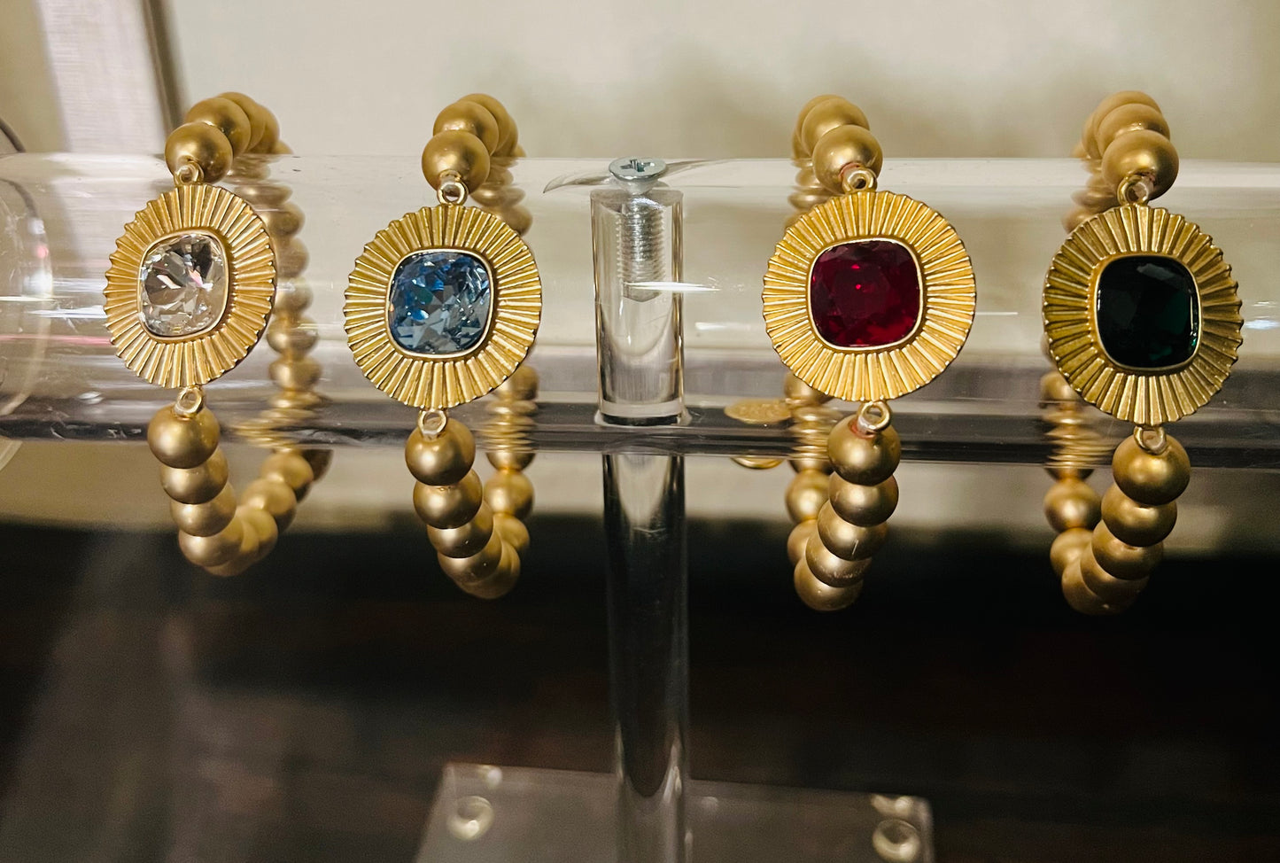 Gold Bracelets with Jeweled Stones